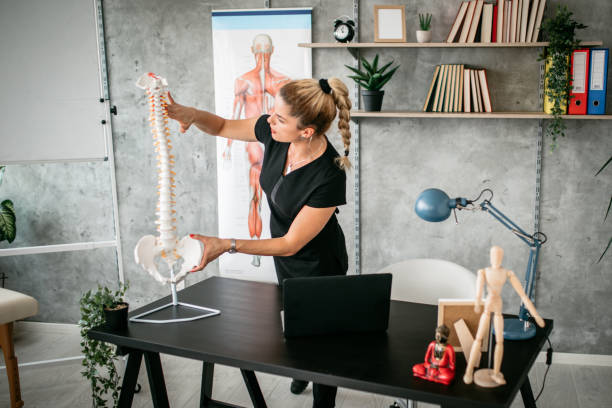 Massage Therapist Instructor giving lecture in classroom