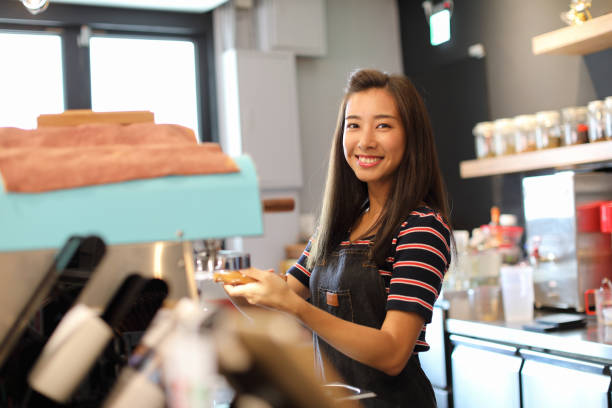 istock Barista in coffee shop 1172602818