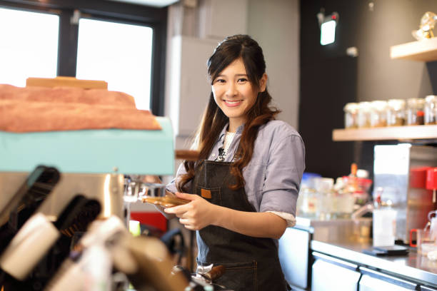 istock Barista in coffee shop 1172604176