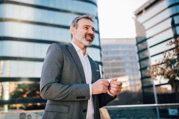 istock Businessman with beard walking downtown 1172604255