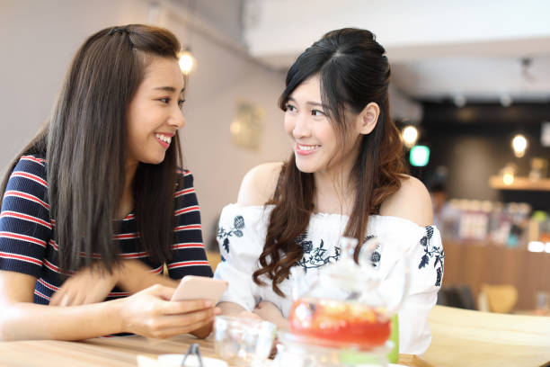 istock Female friends talking in cafe 1172604319