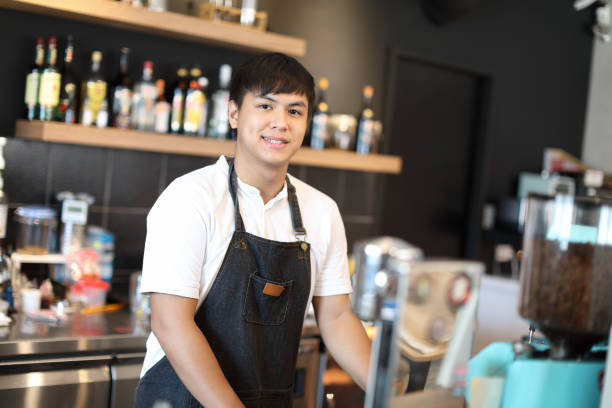 istock Barista in coffee shop 1172604554