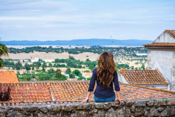 Woman enjoying view of countryside near University of Évora, Portugal stock photo