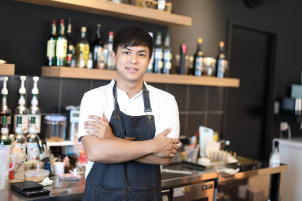 istock Barista in coffee shop 1172605650
