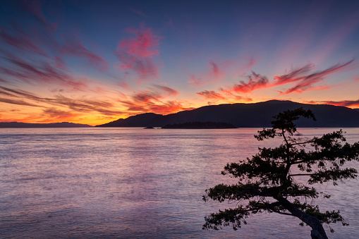 red sunset glow at Juniper Point, Lighthouse Park, West Vancouver, BC, Canada