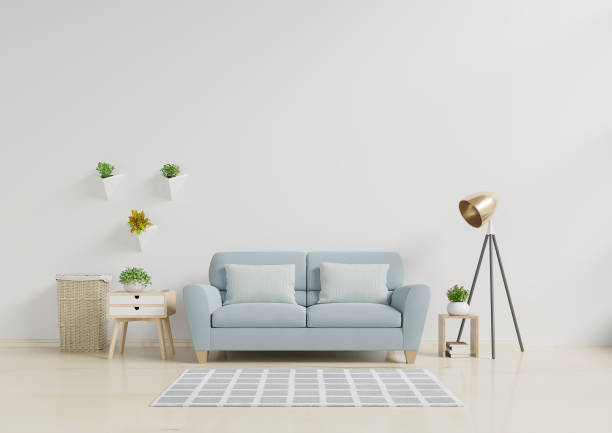 istock Modern living room interior with sofa and green plants,lamp,table on white wall background. 1172613824
