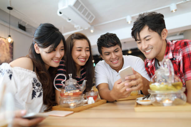 istock Sharing funny memories on smart phone 1172617631