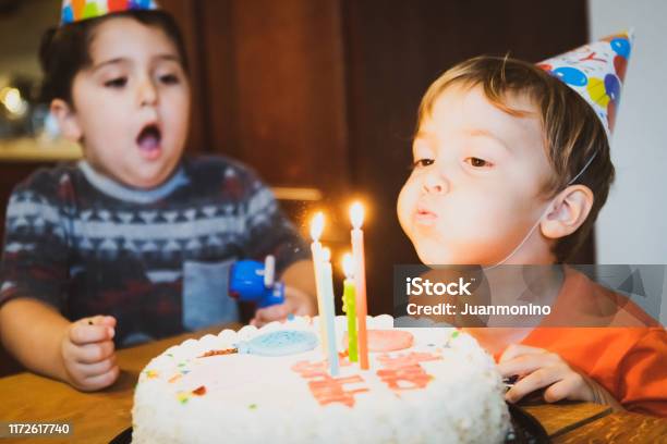 Vintage Image From The Seventies Children Blowing Birthday Cake Candles Stock Photo - Download Image Now