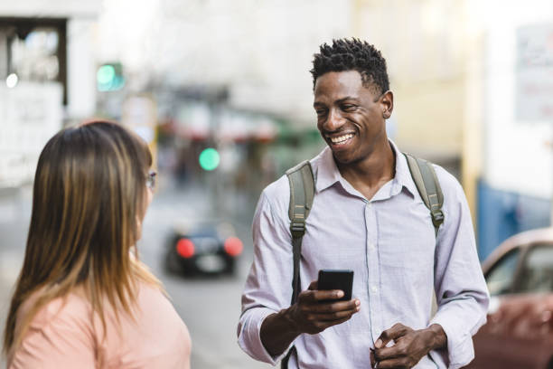 istock Coworkers on the street talking and using smart phone 1172619417