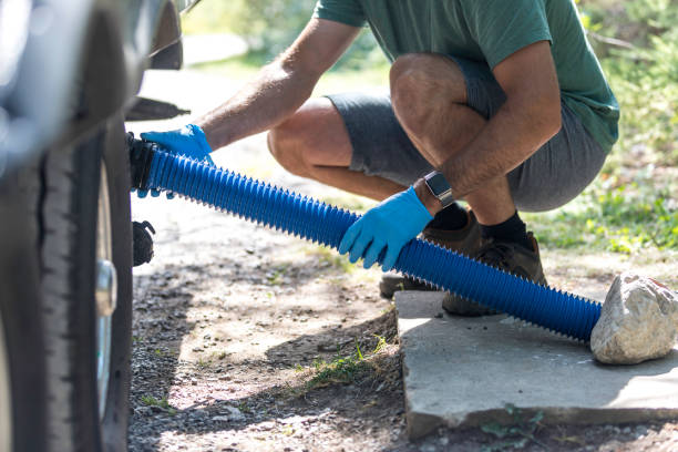 istock Man Emptying RV Sewer After Camping 1172622107