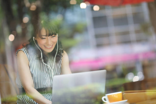 istock one woman at cafe using laptop 1172625191