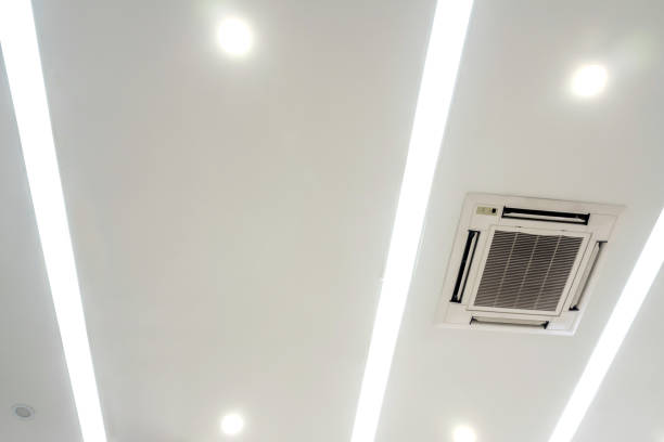 istock Lighting and ceiling mounted air conditioner on the modern office ceiling 1172625840