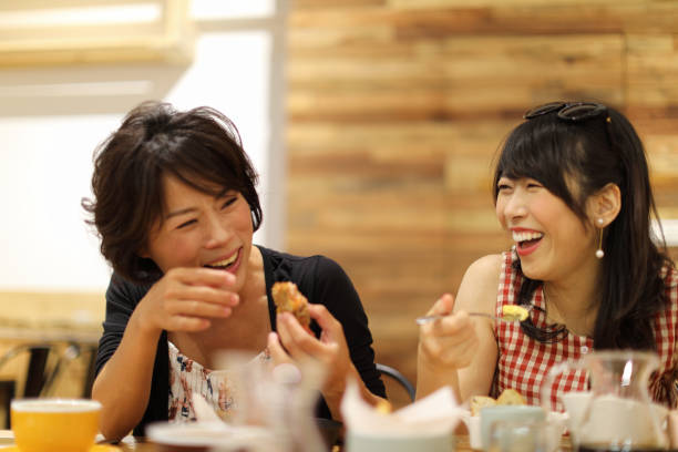 istock Two women friends eating in cafe 1172627336