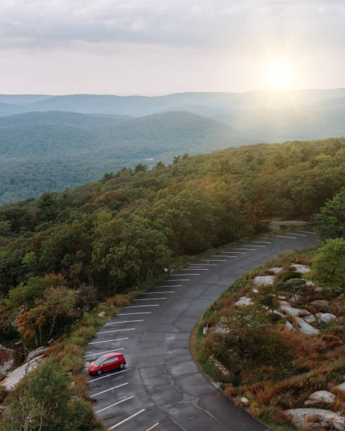 istock Car on the road with sunset 1172628342