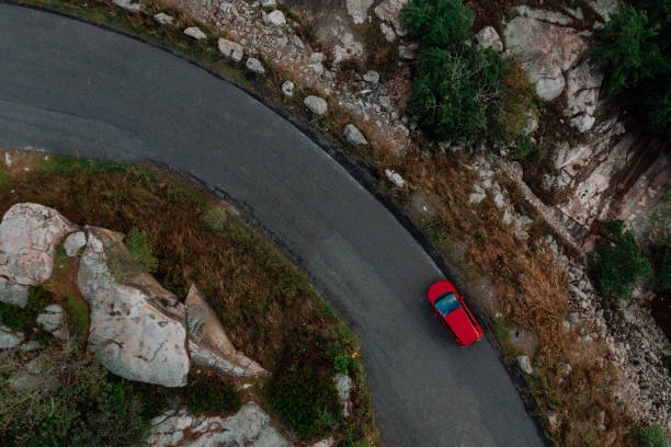 istock Car on the road with sunset 1172629173