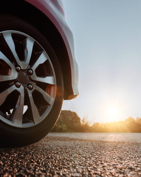 istock Car on the road with sunset 1172629321