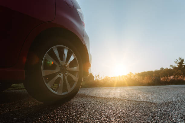 istock Car on the road with sunset 1172629355