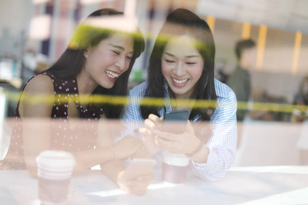 istock Female friends talking in cafe 1172630654