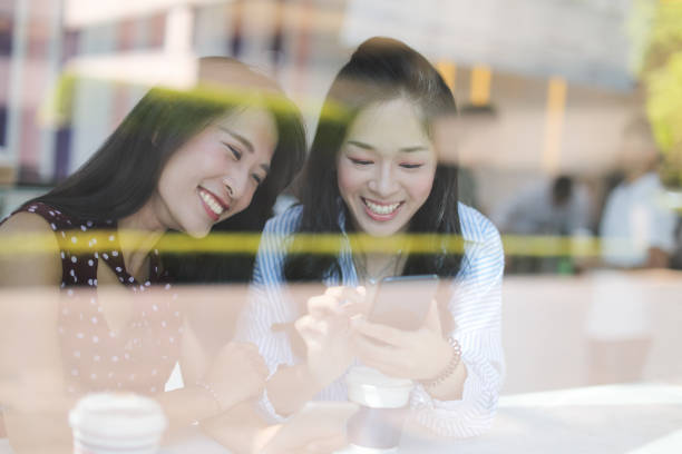 istock Female friends talking in cafe 1172630833