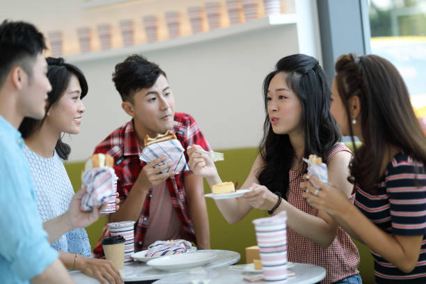 istock young people enjoying dessert in cafe 1172632980