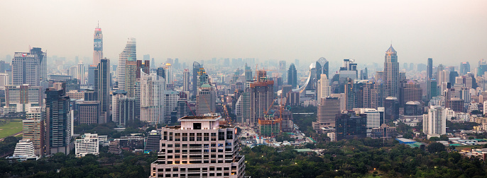 Panoramic downtown Bangkok aerial skyline view late afternoon with a multitude of skyscrapers.