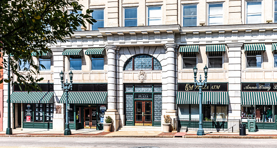 In Omaha, United States the table and chairs outside a small downtown business are empty.