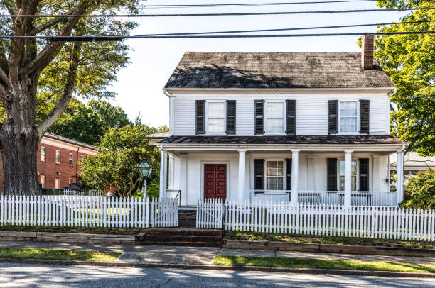 Salisbury, NC, USA-1 September 2019:  The Utzman-Chambers house, an 1819 Federal townhouse, built by Jacob Stirewalt, stands on Jackson St. in downtown Salisbury.