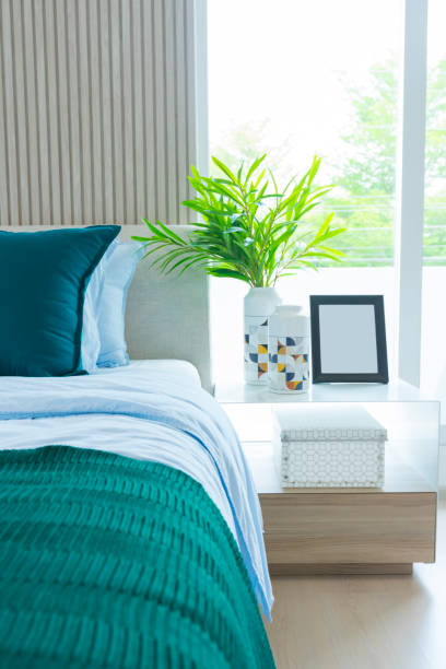 istock Green, yellow and blue pillow on comfortable bed. 1172643048