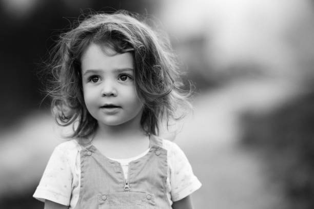 istock Cute little girl looking up 1172643677