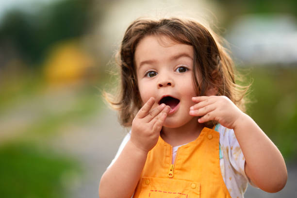 istock Oops! Little girl being surprised 1172643988