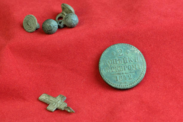istock vintage items on a red cloth lie on a table, 18th century Russian items 1172646221