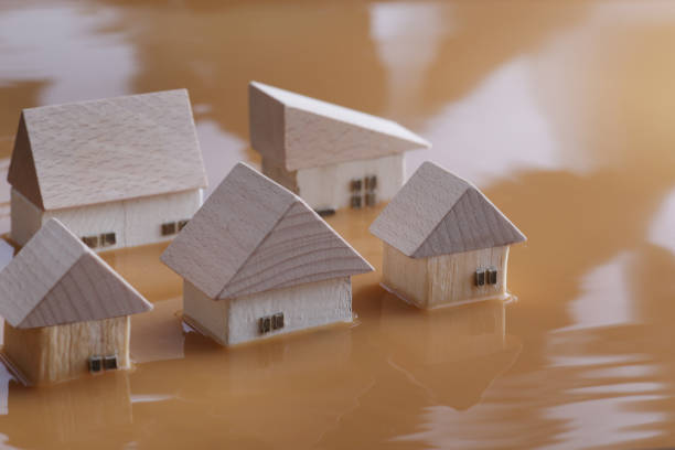 People who seek water for flooding up to half of their homes In the diorama landscape of people who seek water for up to half of their homes due to floods, the movement of the water surface was expressed in the photo. diorama photos stock pictures, royalty-free photos & images