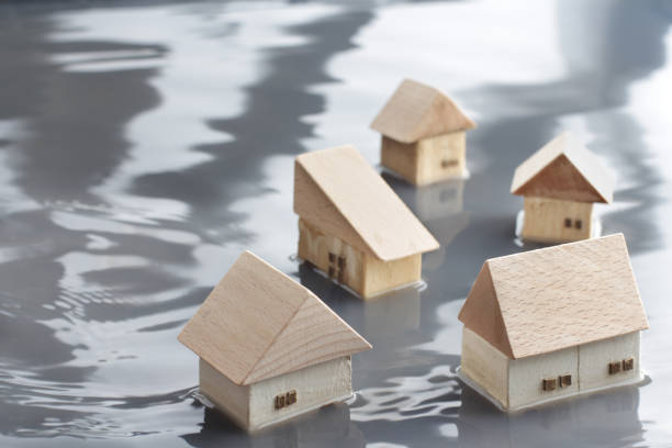 People who seek water for flooding up to half of their homes In the diorama landscape of people who seek water for up to half of their homes due to floods, the movement of the water surface was expressed in the photo. diorama photos stock pictures, royalty-free photos & images