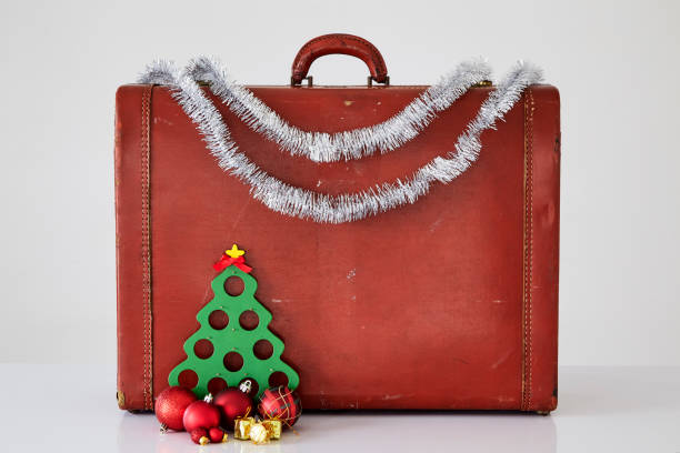istock Vintage suitcase with Christmas decorations on white background. Christmas concept 1172656098