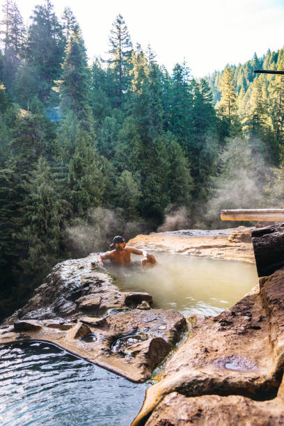 istock man resting in an hot spring in oregon 1172660943