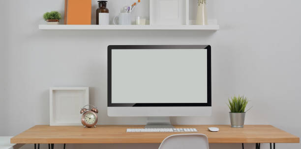 istock Minimal workplace with desktop computer and office supplies with decorations 1172661034