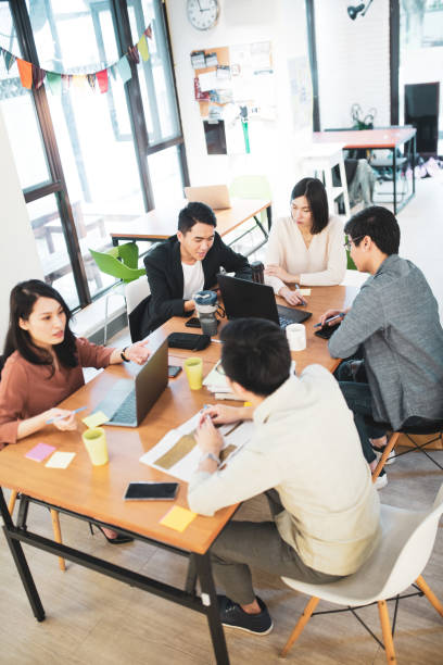 istock Asian colleagues at coworking place 1172661192