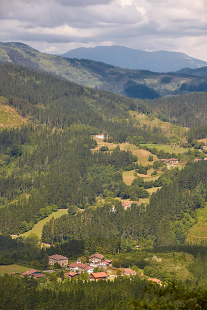 istock Basque country valley surrounded by forest and mountains. Spanish tourism 1172661348
