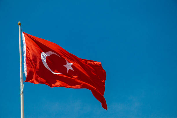 istock Turkish national flag with white star and moon in sky 1172664308