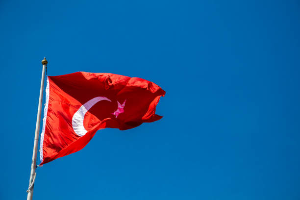 istock Turkish national flag with white star and moon in sky 1172664318