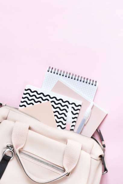 istock Backpack with school supplies and books for study. Back to school concept. Flat lay, top view, pink background 1172671584