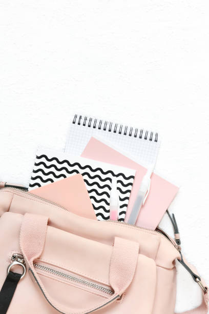 istock Backpack with school supplies and books for study. Back to school concept. Flat lay, top view, white background 1172671655