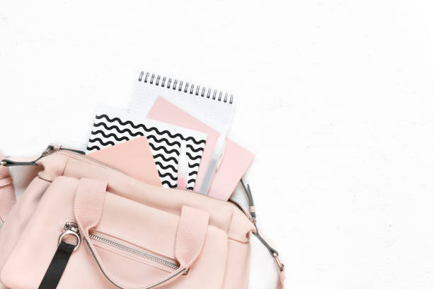istock Backpack with school supplies and books for study. Back to school concept. Flat lay, top view, white background 1172671733