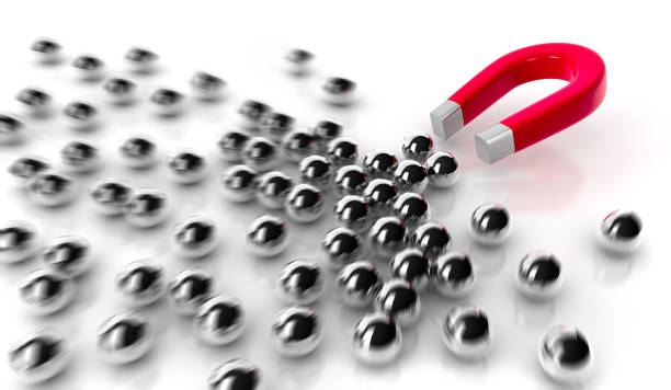 istock Magnet attracting steel balls 1172673680