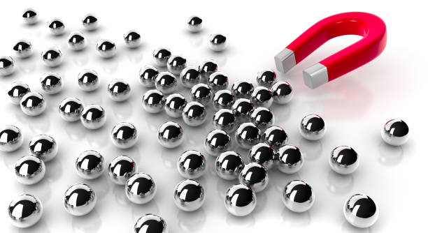istock Magnet attracting steel balls 1172673807