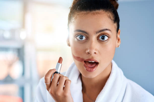 I'm sure I can start a trend with this look Cropped shot of a young woman getting ready in the bathroom at home oops stock pictures, royalty-free photos & images