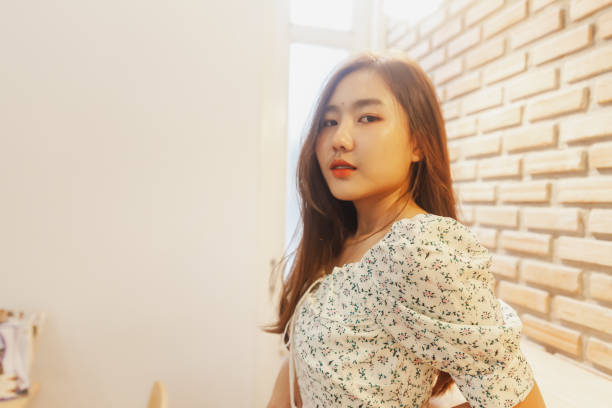 istock Asian women posing action at dining room with copy space. 1172679344