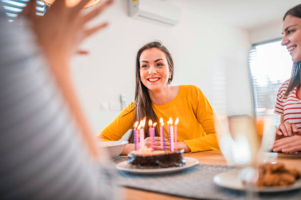 istock Friends celebrating birthday at home 1172679810