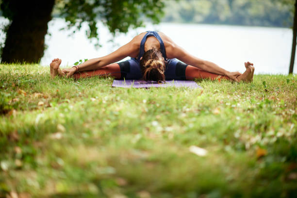 istock Woman practicing yoga in nature. 1172681627