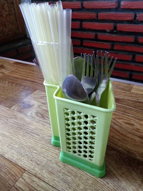istock place green spoons and forks 1172682085